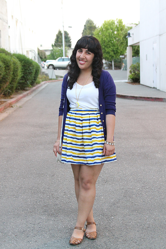 White T-Shirt Styled with a Striped Skirt and Cardigan